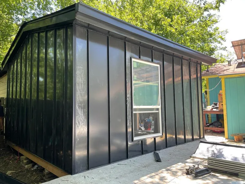 Black standing seam metal wall panels for Roof Inspection in Coral Springs