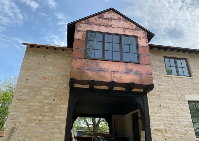 Copper metal panel facade on a stone building for Skylight Installation in Coral Springs