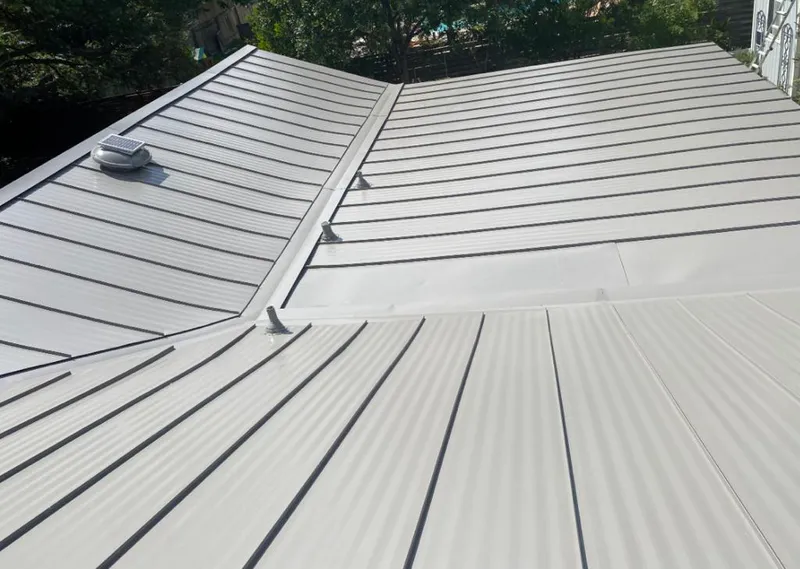 Solar attic fan installed on a metal roof for Roof Ventilation in Coral Springs